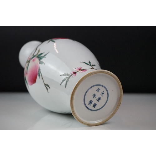 10 - 20th century Chinese Porcelain Baluster Vase decorated in enamels with flowering peach branches, six... 