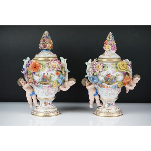 14 - Pair of Continental Porcelain Vases and covers of baluster form decorated with hand painted panels o... 