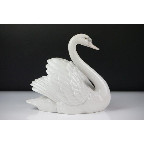 16 - Lladro porcelain figure of a swan swimming, model no. 5231, approx 18.5cm high