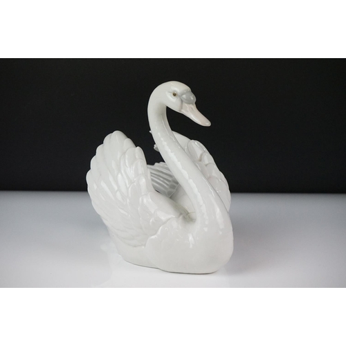 16 - Lladro porcelain figure of a swan swimming, model no. 5231, approx 18.5cm high