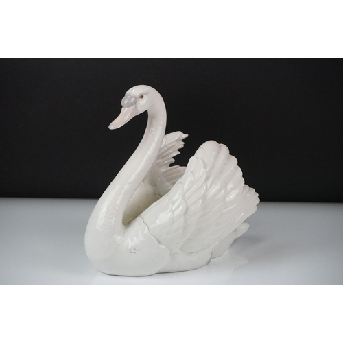 16 - Lladro porcelain figure of a swan swimming, model no. 5231, approx 18.5cm high