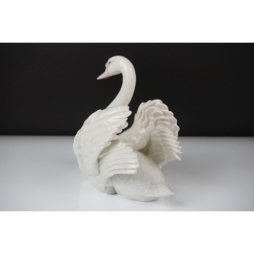 16 - Lladro porcelain figure of a swan swimming, model no. 5231, approx 18.5cm high