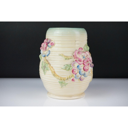 26 - Clarice Cliff Newport Pottery vase of baluster form, with polychrome moulded blossom decoration on a... 