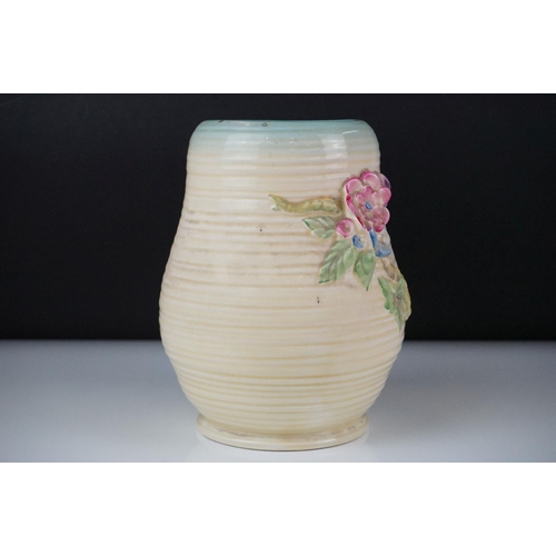 26 - Clarice Cliff Newport Pottery vase of baluster form, with polychrome moulded blossom decoration on a... 