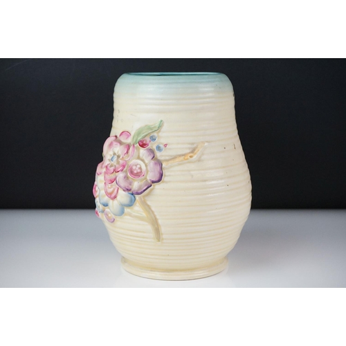 26 - Clarice Cliff Newport Pottery vase of baluster form, with polychrome moulded blossom decoration on a... 