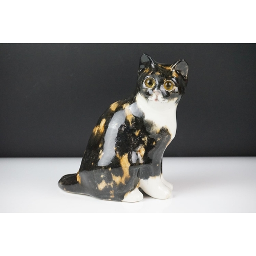 27 - Winstanley pottery figure of a seated tabby cat with glass eyes, size 2, signed Winstanley to base, ... 