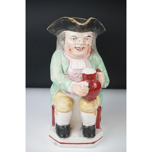 28 - 19th Century Staffordshire Toby jug modelled as Toby Philpott holding a foaming tankard and pipe, ap... 