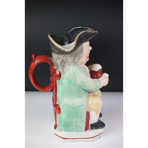 28 - 19th Century Staffordshire Toby jug modelled as Toby Philpott holding a foaming tankard and pipe, ap... 