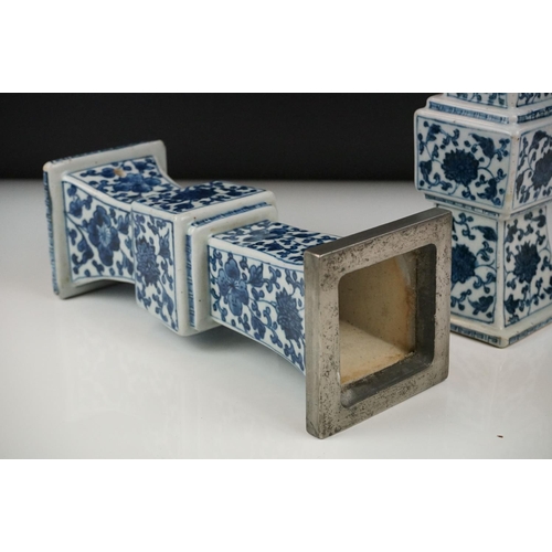 3 - Two similar Chinese ' Gu ' shaped Blue and White Vases decorated with flowers, square white metal ri... 