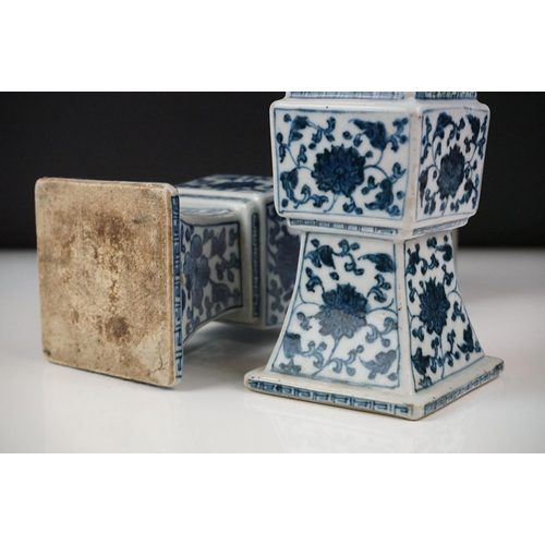 3 - Two similar Chinese ' Gu ' shaped Blue and White Vases decorated with flowers, square white metal ri... 