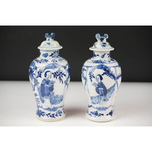 34 - Near Pair of Chinese Blue and White Baluster Lidded Vases decorated with figures and birds, four cha... 