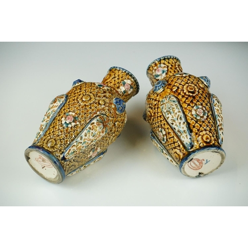 41 - Pair of Alhambrian Majolica vases, late 19th - early 20th century, with brown glazing and decorated ... 