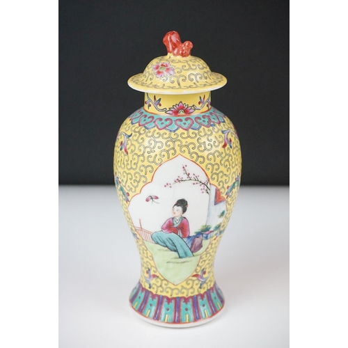 42 - Chinese Porcelain Yellow Ground Lidded Baluster Vase decorated with panels of figures, 21cm high tog... 