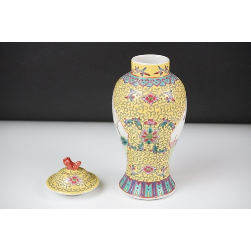 42 - Chinese Porcelain Yellow Ground Lidded Baluster Vase decorated with panels of figures, 21cm high tog... 