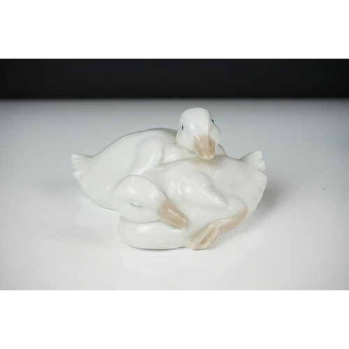 51 - Lladro ' Kissing Doves ' figure group no. 1169, 12cm high, together with two Nao by Lladro porcelain... 