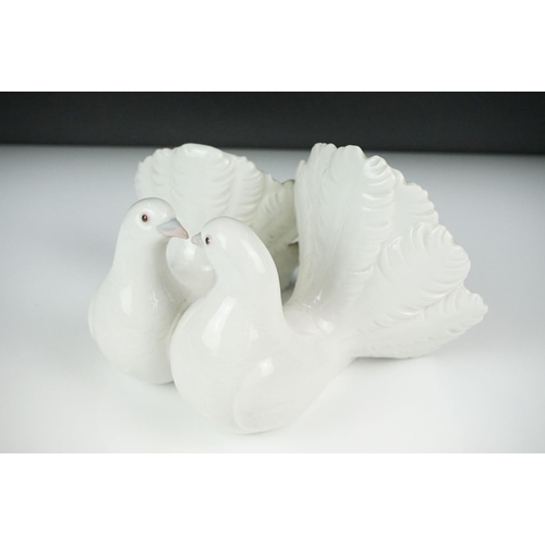 51 - Lladro ' Kissing Doves ' figure group no. 1169, 12cm high, together with two Nao by Lladro porcelain... 