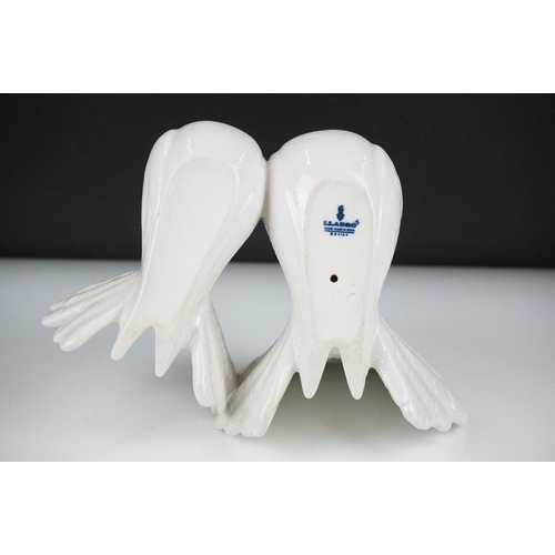 51 - Lladro ' Kissing Doves ' figure group no. 1169, 12cm high, together with two Nao by Lladro porcelain... 