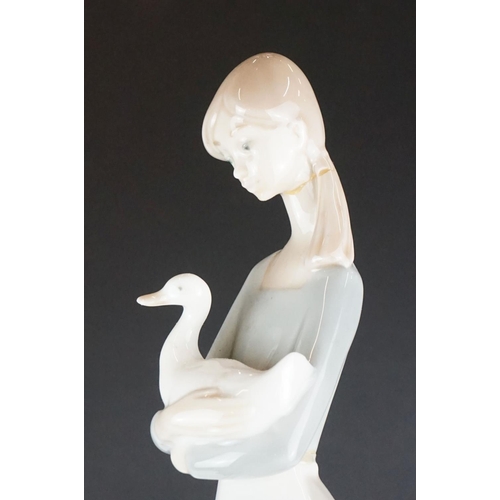 51 - Lladro ' Kissing Doves ' figure group no. 1169, 12cm high, together with two Nao by Lladro porcelain... 