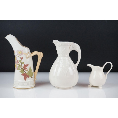 54 - Royal Worcester blush ivory tusk-shaped jug painted with flowers, with gilt borders, 19cm high, toge... 