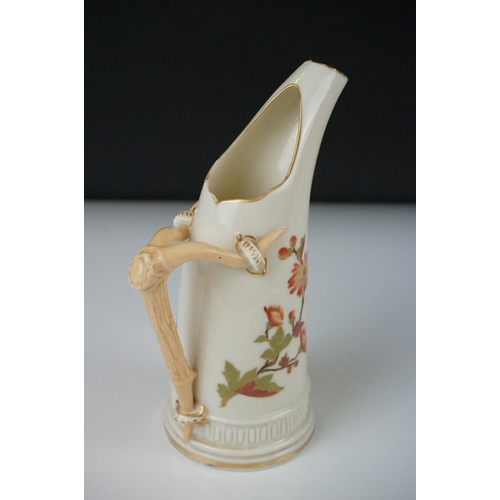 54 - Royal Worcester blush ivory tusk-shaped jug painted with flowers, with gilt borders, 19cm high, toge... 