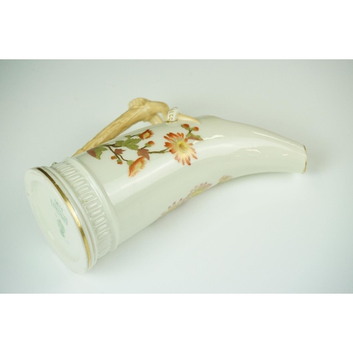 54 - Royal Worcester blush ivory tusk-shaped jug painted with flowers, with gilt borders, 19cm high, toge... 