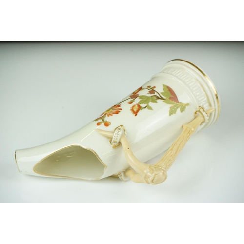 54 - Royal Worcester blush ivory tusk-shaped jug painted with flowers, with gilt borders, 19cm high, toge... 