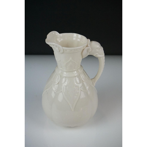 54 - Royal Worcester blush ivory tusk-shaped jug painted with flowers, with gilt borders, 19cm high, toge... 