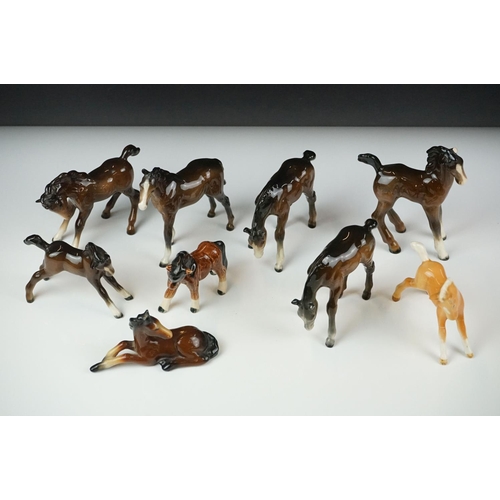 59 - Seven Beswick porcelain foals, mostly brown gloss examples, tallest approx 13cm, all with printed ma... 