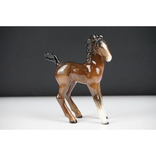 59 - Seven Beswick porcelain foals, mostly brown gloss examples, tallest approx 13cm, all with printed ma... 