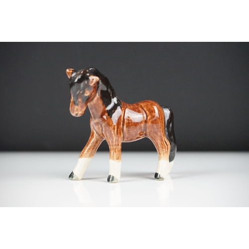 59 - Seven Beswick porcelain foals, mostly brown gloss examples, tallest approx 13cm, all with printed ma... 