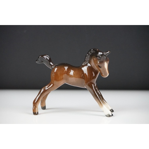 59 - Seven Beswick porcelain foals, mostly brown gloss examples, tallest approx 13cm, all with printed ma... 