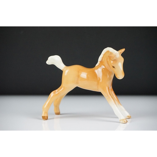 59 - Seven Beswick porcelain foals, mostly brown gloss examples, tallest approx 13cm, all with printed ma... 