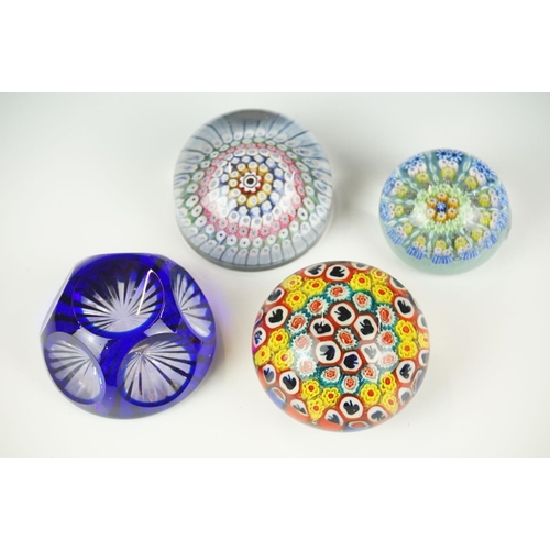 62 - Four glass paperweights to include 3 millefiori examples, featuring a Perthshire paperweight with la... 