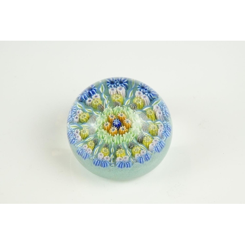 62 - Four glass paperweights to include 3 millefiori examples, featuring a Perthshire paperweight with la... 