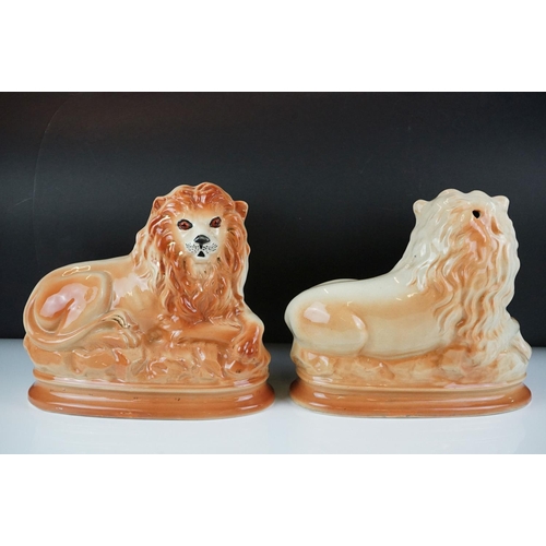 73 - Pair of Staffordshire seated lions with glass eyes, approx 27cm wide, together with three Royal Worc... 