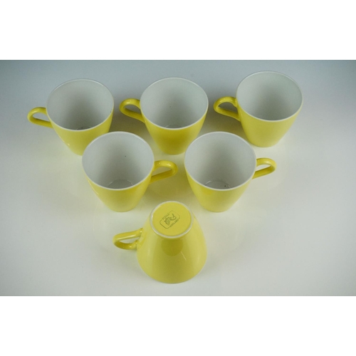 76 - Poole Pottery bright yellow coffee service to include a coffee pot & cover, hot water jug, 6 tall co... 