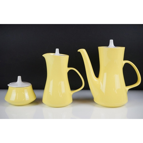 76 - Poole Pottery bright yellow coffee service to include a coffee pot & cover, hot water jug, 6 tall co... 