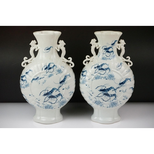 8 - Pair of Chinese Porcelain Moon Flasks, each with two dragon or qilin handles, decorated with shrimps... 