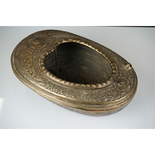 132 - 19th Century Persian brass Kashkul 'begging bowl' heavily embossed and chased with floral and scroll... 