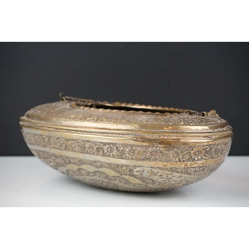 132 - 19th Century Persian brass Kashkul 'begging bowl' heavily embossed and chased with floral and scroll... 