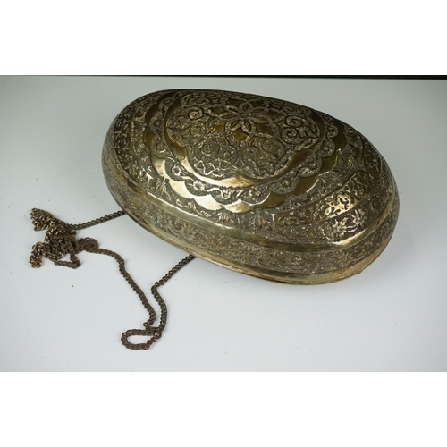 132 - 19th Century Persian brass Kashkul 'begging bowl' heavily embossed and chased with floral and scroll... 