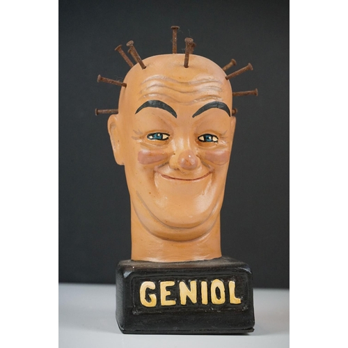 133 - Grotesque plaster bust of a man with nails in skull raised on a plinth marked ' Geniol ', approx 18c... 