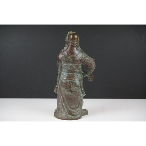 138 - Chinese bronze warrior statue of Guan Gong Yu standing holding a weapon, approx 27cm high