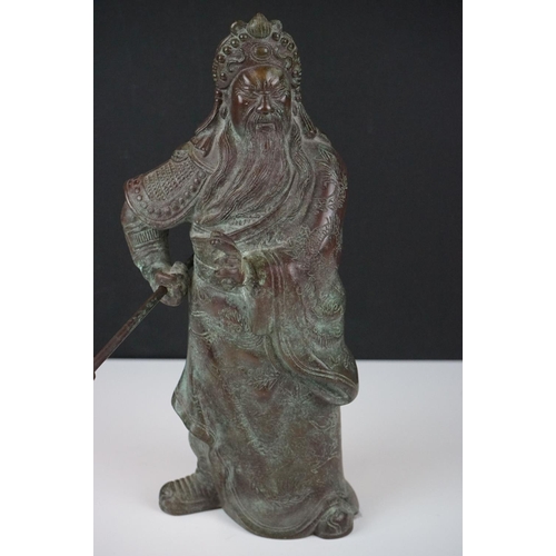 138 - Chinese bronze warrior statue of Guan Gong Yu standing holding a weapon, approx 27cm high