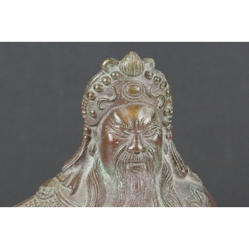 138 - Chinese bronze warrior statue of Guan Gong Yu standing holding a weapon, approx 27cm high