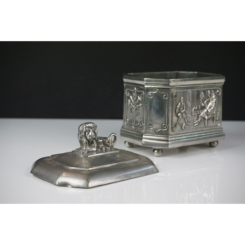 143 - A.E. Williams pewter tea caddy of octagonal form with relief panel decoration depicting a tavern sce... 