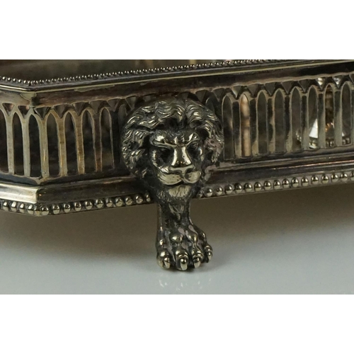 148 - Elkington & Co silver plated tantalus raised on four claw feet with lion mask embellishments, with t... 