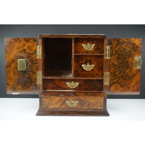 152 - 19th Century burr walnut table top smokers cabinet, with two doors opening to reveal three drawers w... 