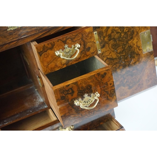 152 - 19th Century burr walnut table top smokers cabinet, with two doors opening to reveal three drawers w... 