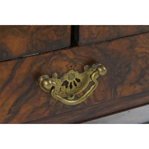 152 - 19th Century burr walnut table top smokers cabinet, with two doors opening to reveal three drawers w... 